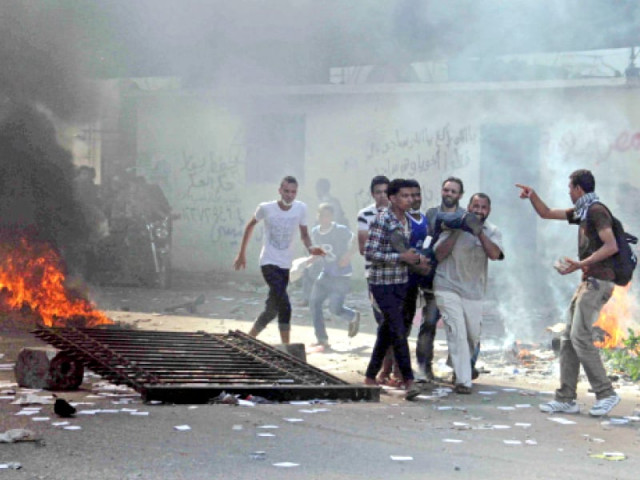 muslim brotherhood supporters carry a wounded man in cairo s ramses square photo afp file muslim brotherhood supporters carry a wounded man in cairo s ramses square photo afp file