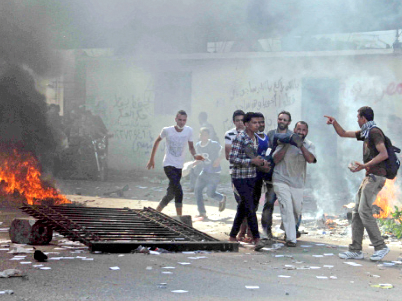 muslim brotherhood supporters carry a wounded man in cairo s ramses square photo afp file