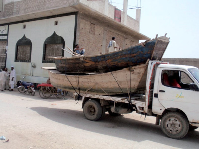 muhammad sukhio from bunder road sukkur is seen building a boat and says he has been doing so just like his forefathers whereas a transporter loads two boats for client delivery charging rs3 000 to rs4 000 per day photo sarfaraz memon express muhammad sukhio from bunder road sukkur is seen building a boat and says he has been doing so just like his forefathers whereas a transporter loads two boats for client delivery charging rs3 000 to rs4 000 per day photo sarfaraz memon express