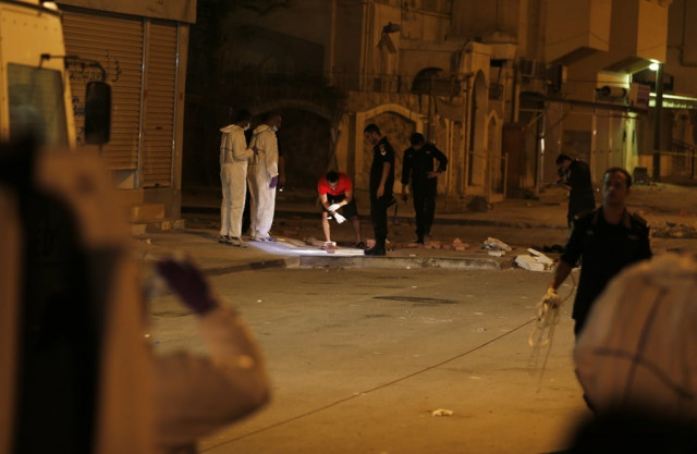 explosive ordnance disposal eod specialists investigate the site of an improvised explosive device blast which injured five riot police officers in the village of dair north of manama photo reuters explosive ordnance disposal eod specialists investigate the site of an improvised explosive device blast which injured five riot police officers in the village of dair north of manama photo reuters