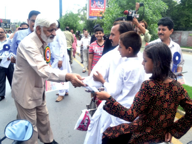 sargodha university vc dr muhammad akram chaudhry distributing awareness pamphlets during an anti dengue walk photo israrul haq and shahid bukhari express sargodha university vc dr muhammad akram chaudhry distributing awareness pamphlets during an anti dengue walk photo israrul haq and shahid bukhari express