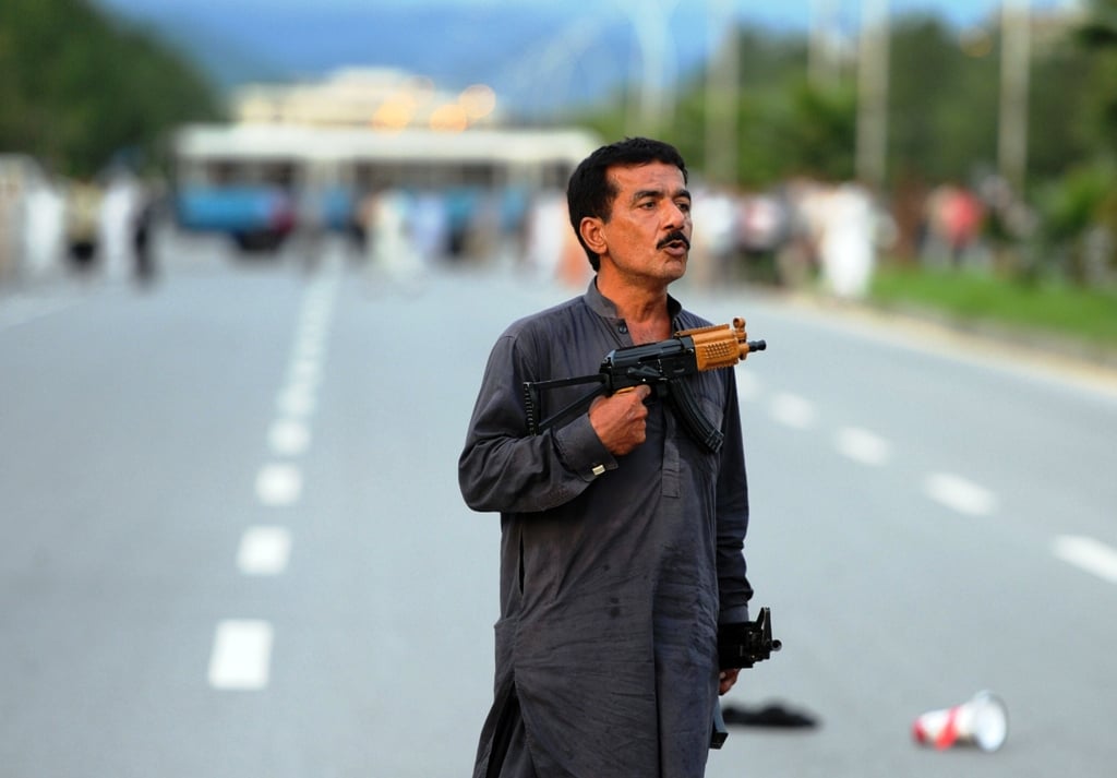 a single man wielding two dara made 30 bore guns managed to engage police and security forces for over five hours right in the heart of the federal capital photo afp