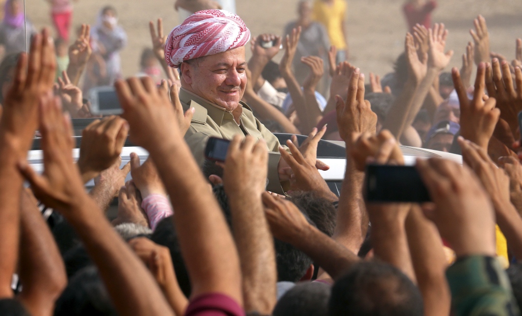 iraqi kurdish president massoud barzani c visits syrian refugees at the quru gusik refugee camp in arbil about 350 km 220 miles north of baghdad august 19 2013 photo reuters