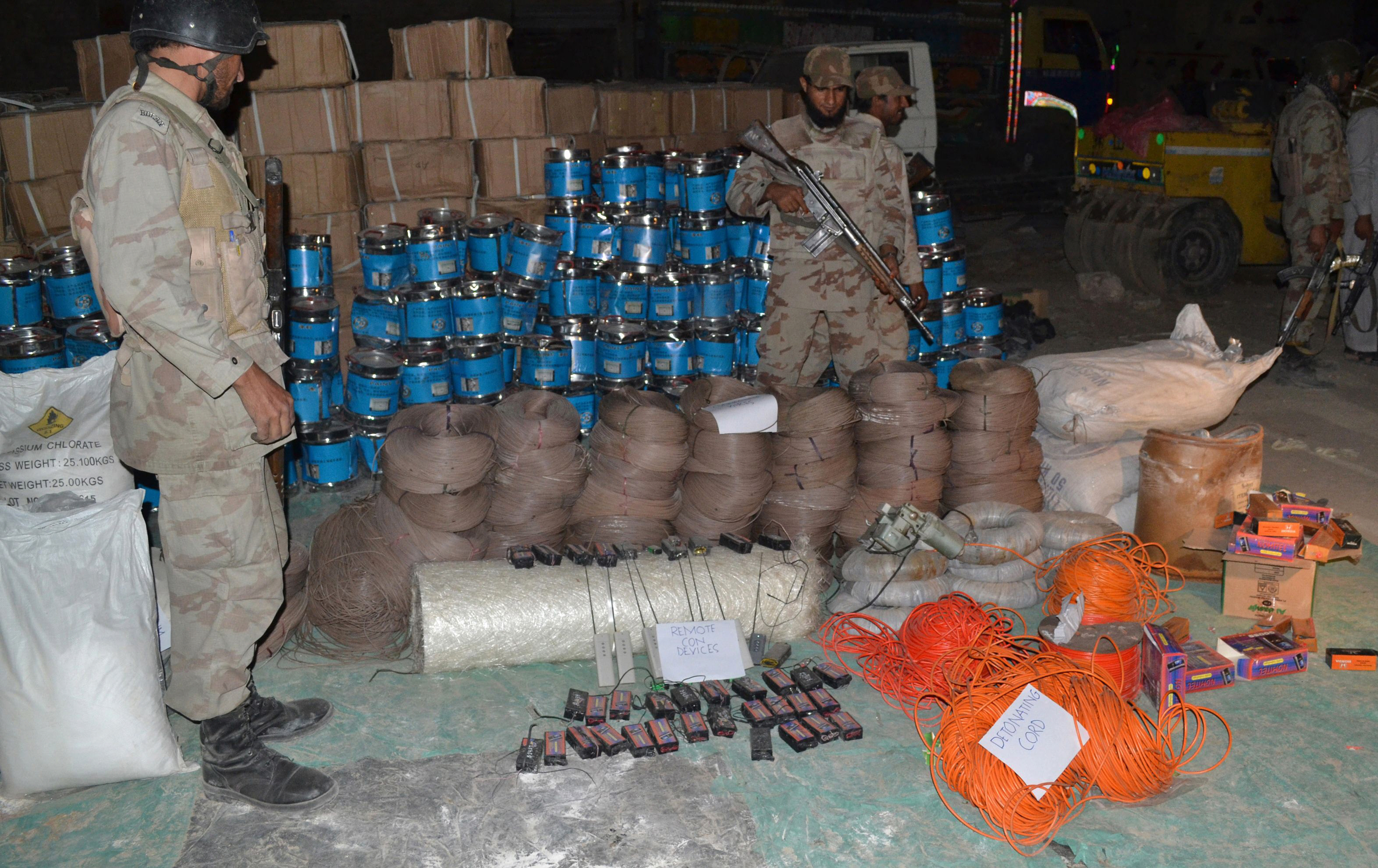 pakistani paramilitary soldiers stand beside seized bomb making material in quetta on august 20 2013 paramilitary forces on august 20 seized more than 100 tonnes of bomb making chemicals from a truck and a compound in southwest pakistan and detained 10 suspects officials said