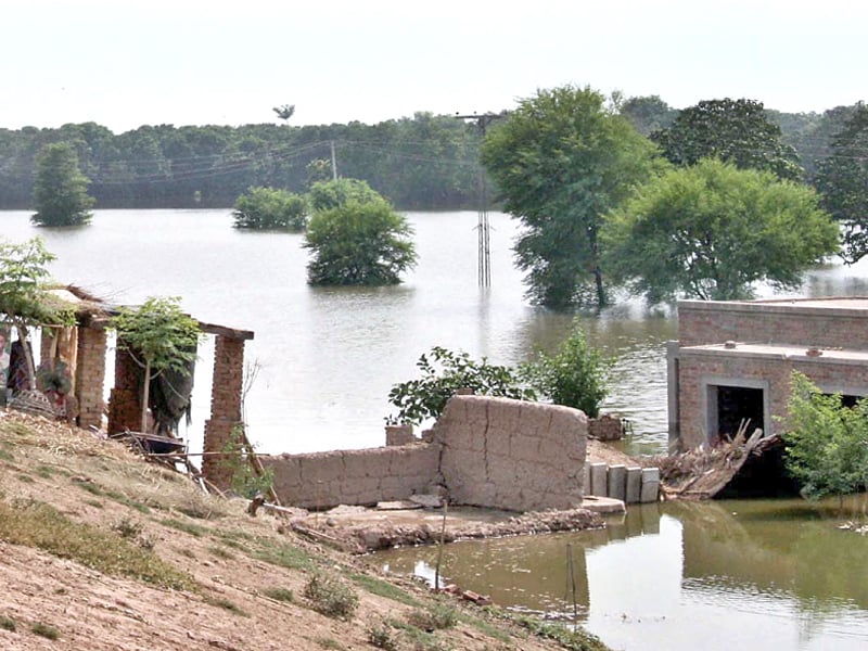 a view of a house partially under water in one of multan s flood hit areas photo app