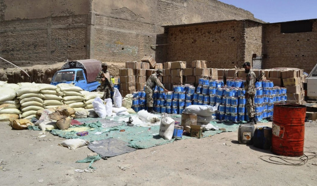 paramilitary soldiers stand near bomb making material which was seized by security forces in quetta august 21 2013 photo reuters paramilitary soldiers stand near bomb making material which was seized by security forces in quetta august 21 2013 photo reuters