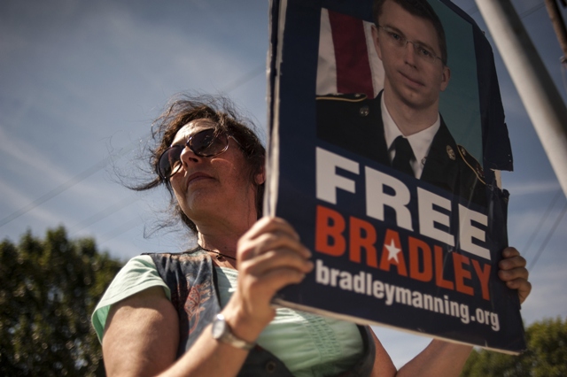 a supporter of us army private first class bradley manning protests outside the main gate before the reading of the verdict in manning 039 s military trial at fort meade maryland july 30 2013 photo reuters file