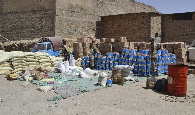 paramilitary soldiers stand near bomb making material which was seized by security forces in quetta august 21 2013 photo reuters paramilitary soldiers stand near bomb making material which was seized by security forces in quetta august 21 2013 photo reuters
