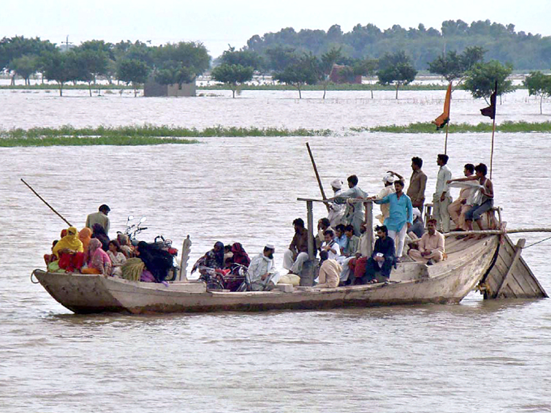 flood affected with their belongings moving to a safer place photo app