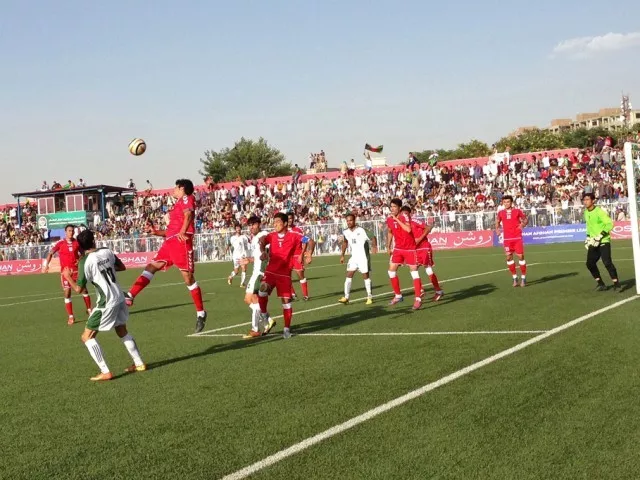 afghanistan national footballers in red compete with pakistan players in green during a football match in kabul stadium on august 20 2013 photo reuters file afghanistan national footballers in red compete with pakistan players in green during a football match in kabul stadium on august 20 2013 photo reuters file