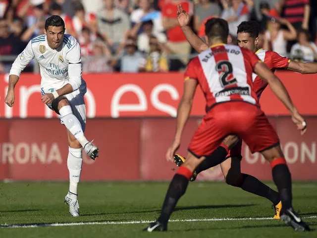 real madrid s portuguese forward cristiano ronaldo l vies with girona s spanish defender juan pedro ramirez during the spanish league football match girona fc vs real madrid cf at the municipal de montilivi stadium in girona on october 29 2017 photo afp real madrid s portuguese forward cristiano ronaldo l vies with girona s spanish defender juan pedro ramirez during the spanish league football match girona fc vs real madrid cf at the municipal de montilivi stadium in girona on october 29 2017 photo afp