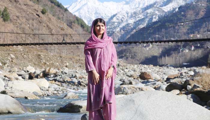 nobel peace prize laureate and education activist malala yousafzai poses for a picture at riverside in her home village barkana shangla district khyber pakhtunkhwa on march 5 2025 courtesy x malala