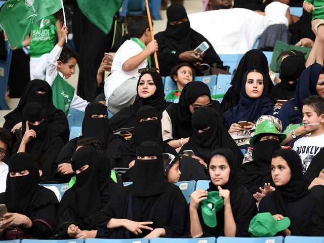 saudi women sit in a stadium for the first time to attend an event in the capital riyadh on sept 23 commemorating the anniversary of the founding of the kingdom photo afp