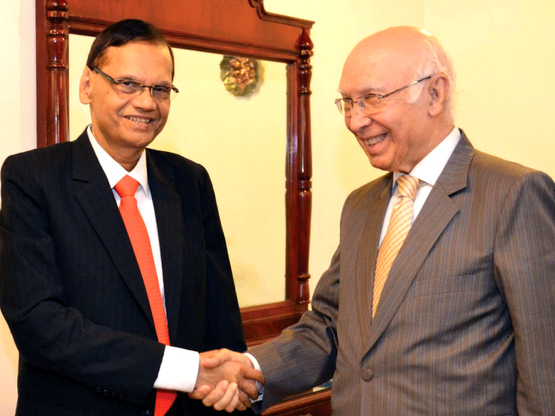 advisor to pm on foreign affairs sartaj aziz greets external affairs minister of sri lanka gl peiris prior to their meeting at the foreign office photo inp