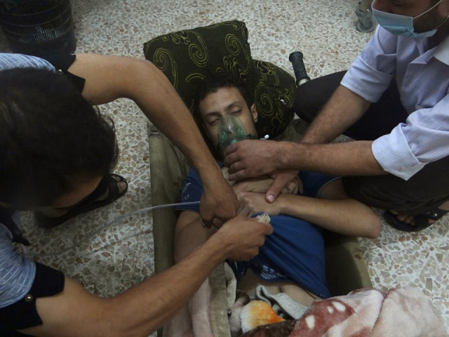 a man affected by what activists say is nerve gas breathes through an oxygen mask in the damascus suburbs of jesreen on august 21 2013 photo reuters file a man affected by what activists say is nerve gas breathes through an oxygen mask in the damascus suburbs of jesreen on august 21 2013 photo reuters file