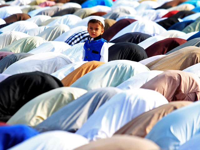 a child watches adults attending eid prayers in rawalpindi pakistan on september 13 2016 photo reuters a child watches adults attending eid prayers in rawalpindi pakistan on september 13 2016 photo reuters