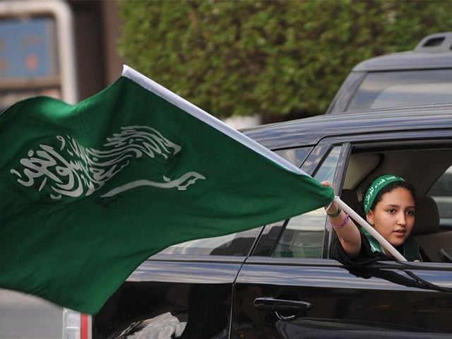 a saudi girl waves a national flag during celebrations of the 81st saudi arabian national day in the desert kingdoms capital riyadh on september 23 2011 photo afp