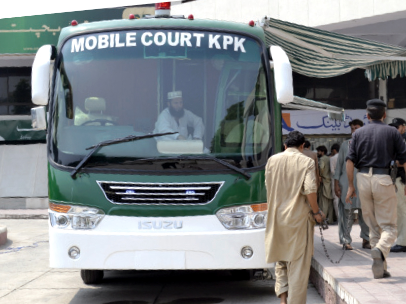 the first day of the mobile court remained busy as 28 cases were dealt with there are plans to have travelling courts in all districts of k p photo zeeshan anwar express