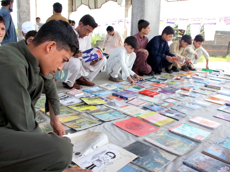 children and parents take interest in the books exhibited in the book fair in matta that was held from aug 14 15 photo fazal khaliq express