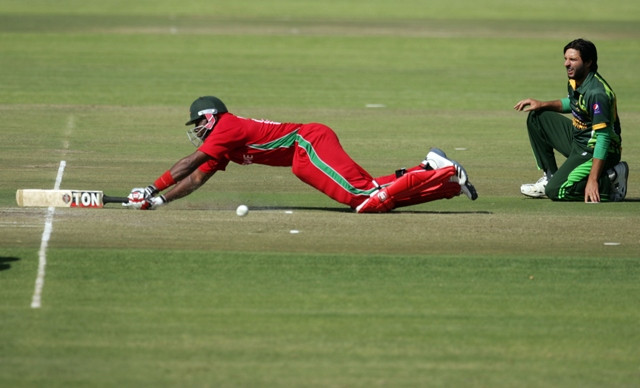 zimbabwe batsman hamilton masakdza survives a run out attempt as shahid afridi watches photo afp zimbabwe batsman hamilton masakdza survives a run out attempt as shahid afridi watches photo afp
