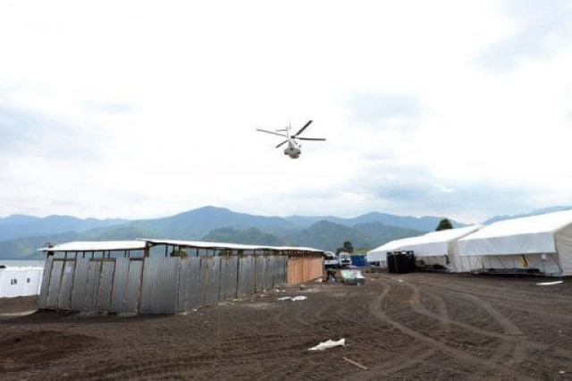 a united nations peacekeeping mission helicopter flys over a un basecamp in goma on may 29 2013 photo afp file a united nations peacekeeping mission helicopter flys over a un basecamp in goma on may 29 2013 photo afp file