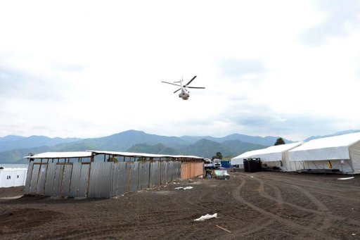 a united nations peacekeeping mission helicopter flys over a un basecamp in goma on may 29 2013 photo afp file