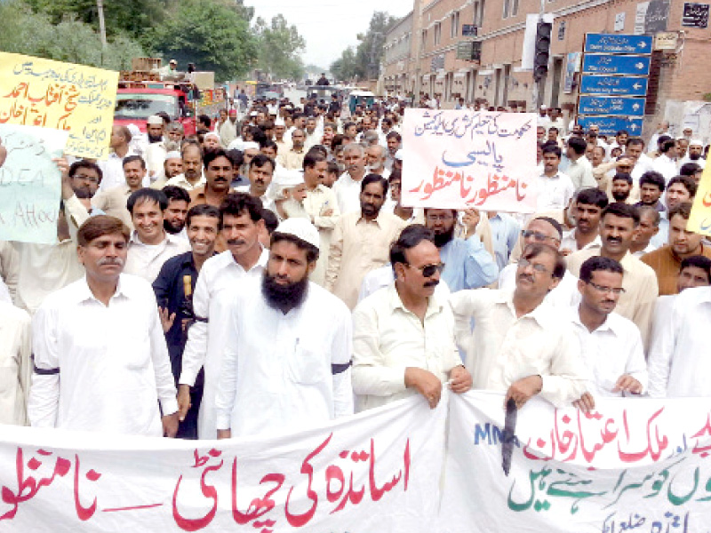 teachers of government schools of attock district protest against the new education policy of the punjab government express photo