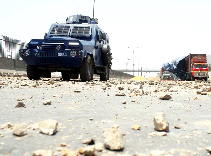 an armored personnel carrier drives through karachi streets after a protest photo inp file