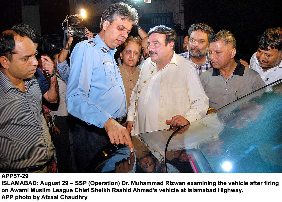 ssp operations dr rizwan examining the car of sheikh rasheed after the firing ncident photo app