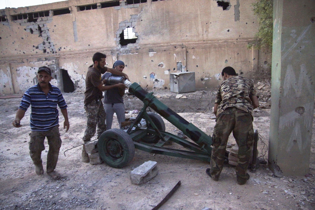 free syrian army fighters prepare to launch a rocket against forces loyal syria 039 s president bashar al assad in deir al zor august 29 2013 photo reuters