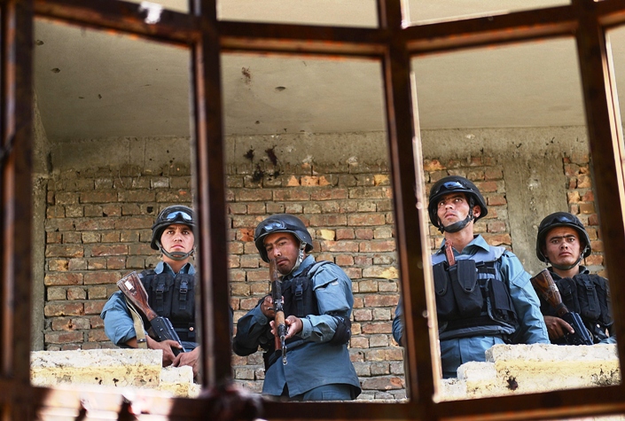 afghanistan policemen stand guard in a building which was used for an attack photo afp file