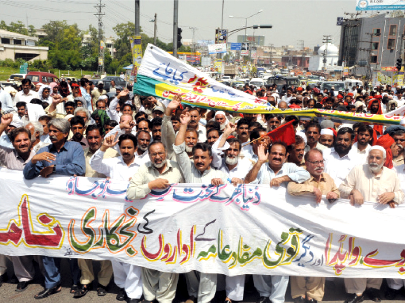 workers and members of wapda and railways unions protest against cruel policies of the pml n government photo waseem imran express