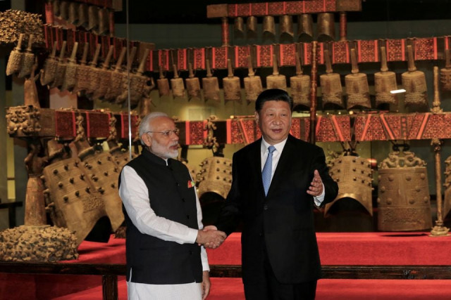 chinese president xi jinping and indian prime minister narendra modi shake hands as they visit the hubei provincial museum in wuhan hubei province china april 27 2018 china daily via reuters chinese president xi jinping and indian prime minister narendra modi shake hands as they visit the hubei provincial museum in wuhan hubei province china april 27 2018 china daily via reuters