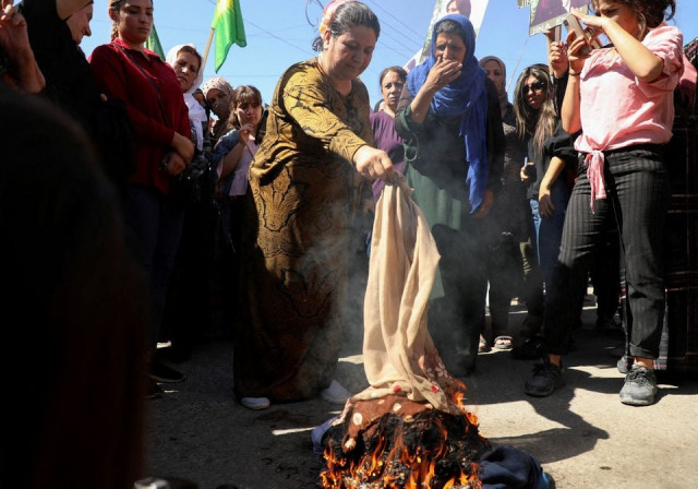 women burn headscarves during a protest over the death of 22 year old kurdish woman mahsa amini in iran in the kurdish controlled city of qamishli northeastern syria september 26 2022 reuters orhan qereman file photo women burn headscarves during a protest over the death of 22 year old kurdish woman mahsa amini in iran in the kurdish controlled city of qamishli northeastern syria september 26 2022 reuters orhan qereman file photo