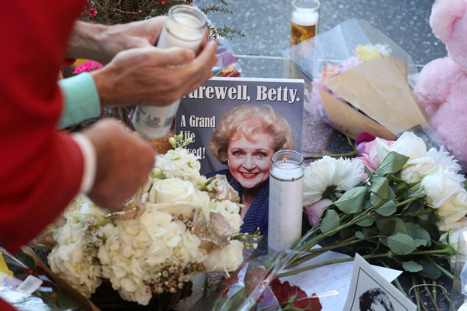 Mourners gather around the Hollywood Walk of Fame star of actor Betty White, who died at the age of 99, in Los Angeles, California, US. December 31, 2021. REUTERS/David Swanson