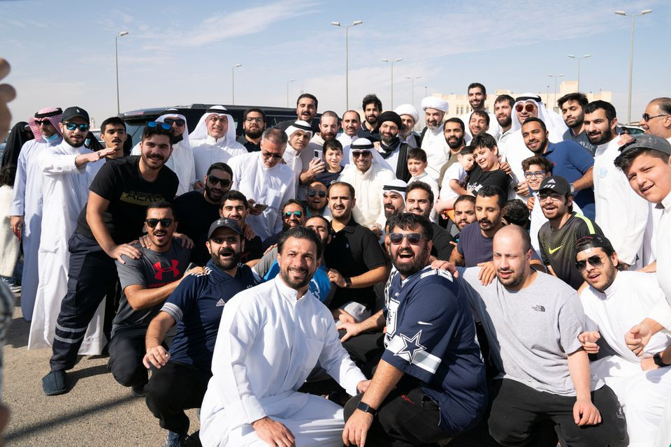 kuwaiti political prisoners pose for group photo with their relatives and friends after they were released in kuwait november 14 2021 reuters