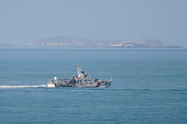 a china coast guard vessel travels in the waters off the 68 nautical mile scenic spot one of mainland china s closest points to the island of taiwan in pingtan island fujian province china august 5 2022 reuters