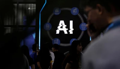 visitors stand near a sign of artificial intelligence at an ai robot booth at security china an exhibition on public safety and security in beijing china june 7 2023 reuters