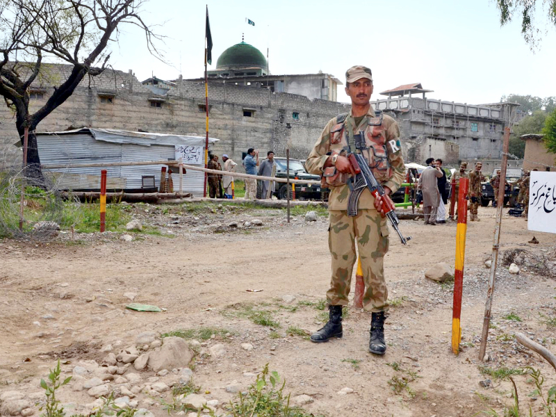 a pakistan army soldier stands guard near bagh area in khyber agency photo inp