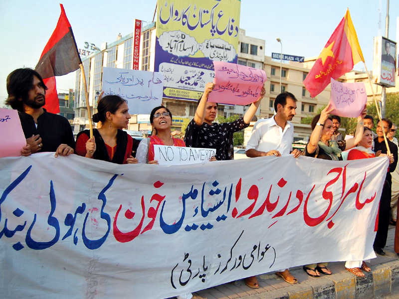 awp members chanting slogans against possible us military action in syria on benazir bhutto road on thursday photo muhammad javaid express