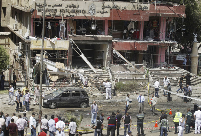 policemen investigate the site of a bomb attack and assassination attempt near the house of egypt 039 s interior minister mohamed ibrahim in the nasr city photo reuters policemen investigate the site of a bomb attack and assassination attempt near the house of egypt 039 s interior minister mohamed ibrahim in the nasr city photo reuters