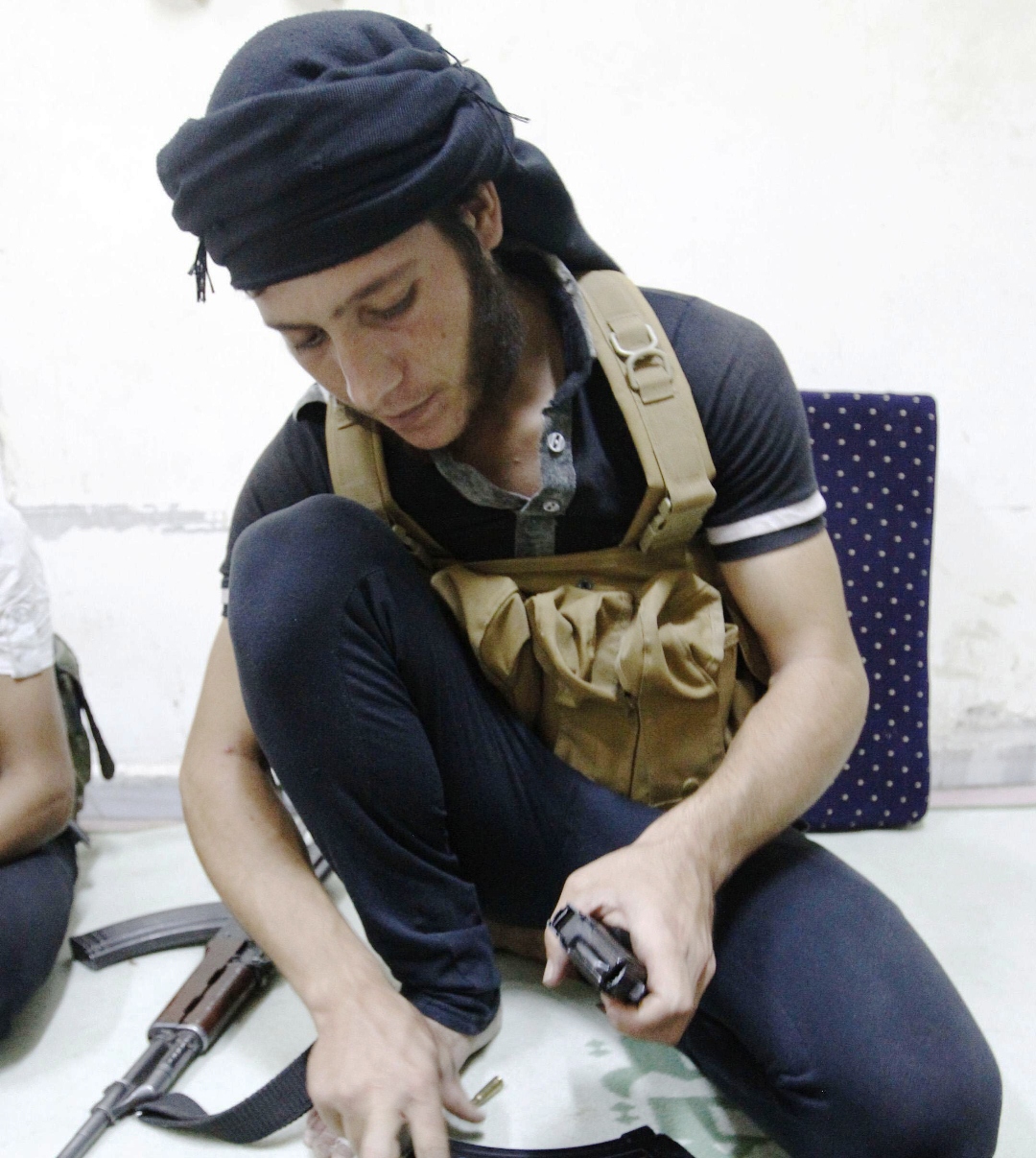a free syrian army fighter loads rounds into a magazine in raqqa province eastern syria september 4 2013 photo reuters