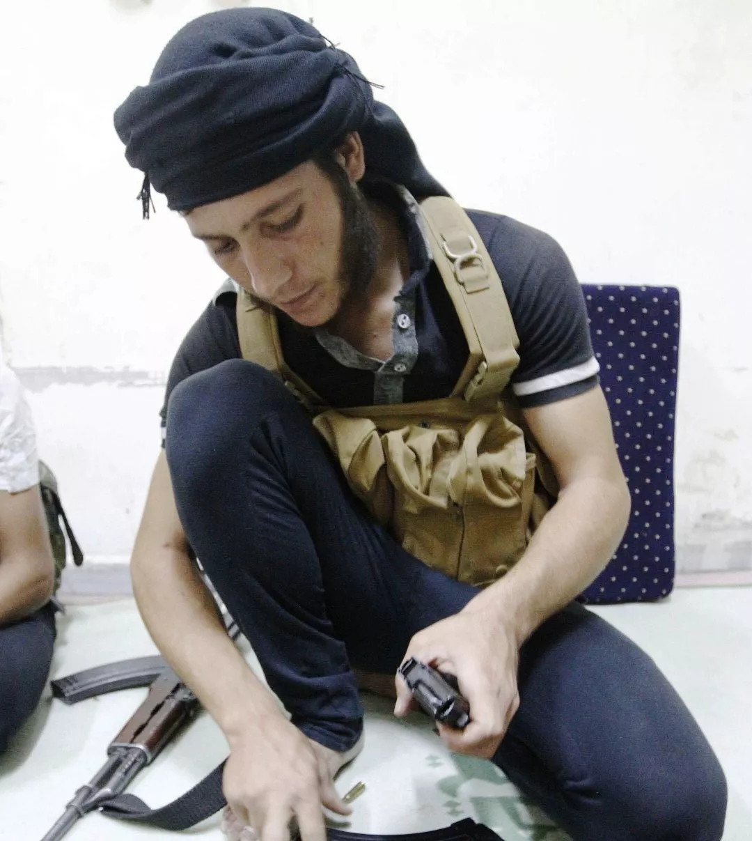 a free syrian army fighter loads rounds into a magazine in raqqa province eastern syria september 4 2013 photo reuters a free syrian army fighter loads rounds into a magazine in raqqa province eastern syria september 4 2013 photo reuters