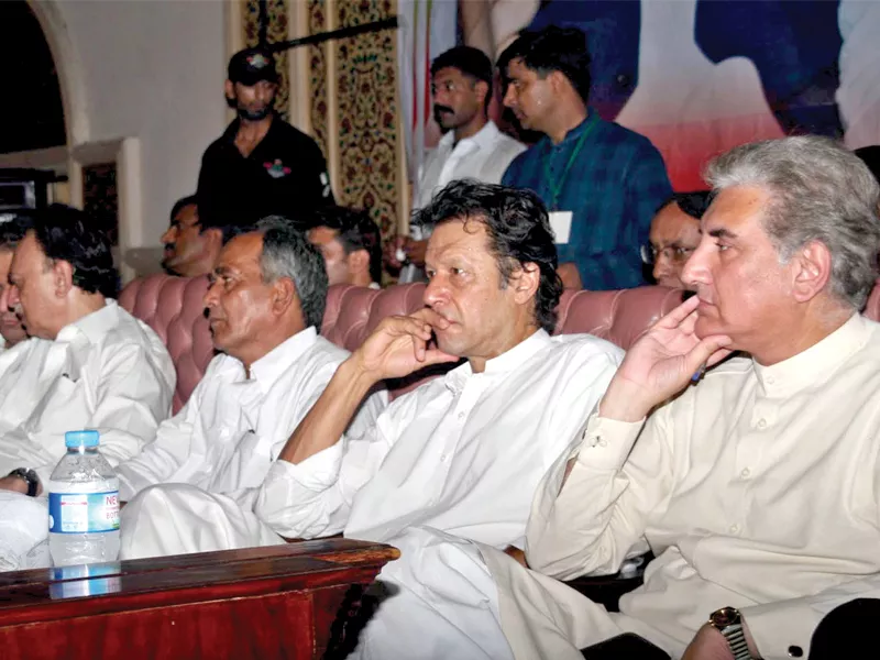 pti chief along with other leaders from the party sit on the stage during a function organised by pti labor wing at aiwan e iqbal photo inp pti chief along with other leaders from the party sit on the stage during a function organised by pti labor wing at aiwan e iqbal photo inp
