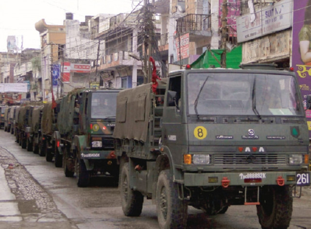 indian army vehicles patrol on a deserted road during a curfew in muzaffarnagar district of uttar pradesh on sunday photo reuters