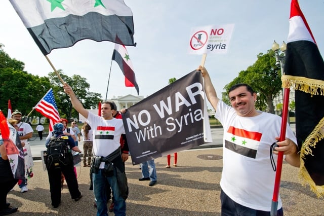 supporters of syrian president bashar al assad take part in a demonstration in front of the white house in washington dc on september 9 2013 urging the us not to attack syria