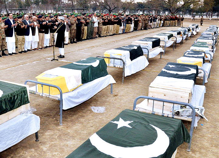 former khyber pakhtunkhwa chief minister amir haider khan hoti offering funeral prayers of suicide blast victims photo app file