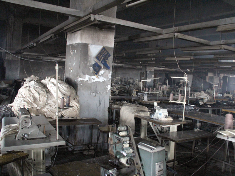 the sewing floor of the garment factory was charred in the fire that took the lives of over 250 workers even though there is a fire extinguisher the factory lacked proper fire exits photo file