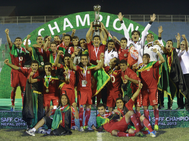 afghanistan football players celebrate with the saff championship 2013 trophy after defeating india during the final match in kathmandu on september 11 2013 photo afp afghanistan football players celebrate with the saff championship 2013 trophy after defeating india during the final match in kathmandu on september 11 2013 photo afp