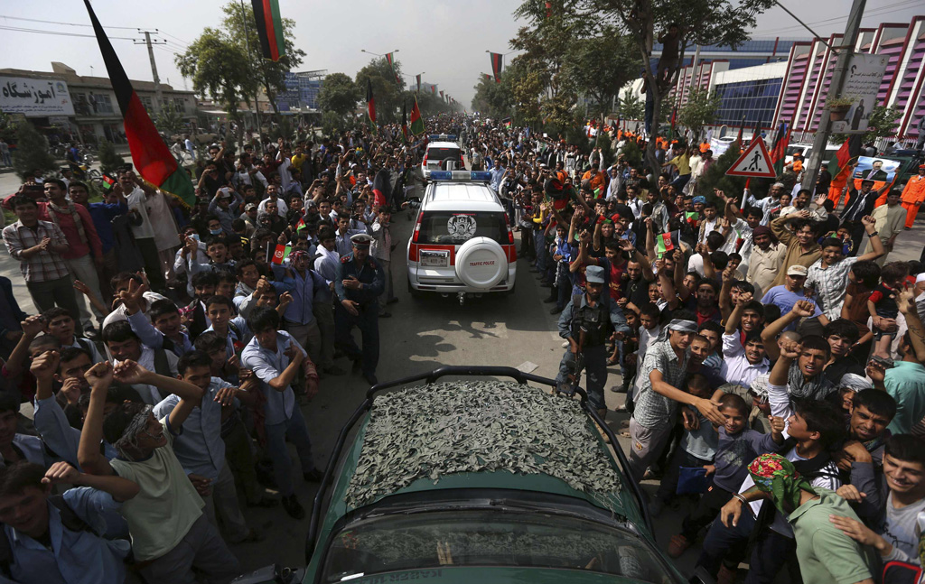 afghan football fans celebrate winning the south asian football federation championship after their team defeated india during the final match in the streets of kabul september 12 2013 photo reuters